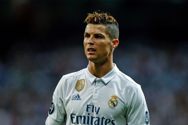 Real Madrid's portuguese forward Cristiano Ronaldo looks on during the UEFA Champions League semi-final first leg football match Real Madrid vs Atletico de Madrid at the Santiago Bernabeu stadium in Madrid on May 2, 2017. / AFP PHOTO / OSCAR DEL POZO        (Photo credit should read OSCAR DEL POZO/AFP/Getty Images)