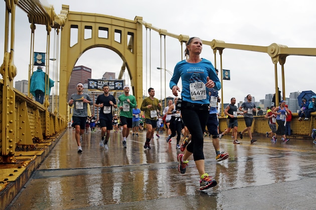 Some of the over 35,000 runners participating in the 2016 Pittsburgh Marathon and 1/2 Marathon cross the Andy Warhol bridge over the Allegheny River at mile fourth of the 26.2 mile course in downtown Pittsburgh, Sunday, May 1, 2016. (AP Photo/Gene J. Puskar)