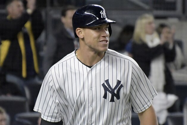 New York Yankees' Aaron Judge smiles after he scored on a single by Chris Carter during the seventh inning of a baseball game against the Toronto Blue Jays on Wednesday, May 3, 2017, at Yankee Stadium in New York. (AP Photo/Bill Kostroun)