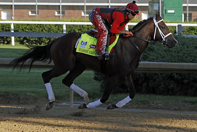 Kentucky Derby hopeful Classic Empire, ridden by exercise rider Martin Rivera, gallops at Churchill Downs in Louisville, Ky., Tuesday, May 2, 2017. The 143rd running of the Kentucky Derby is Saturday, May 6.(AP Photo/Garry Jones)