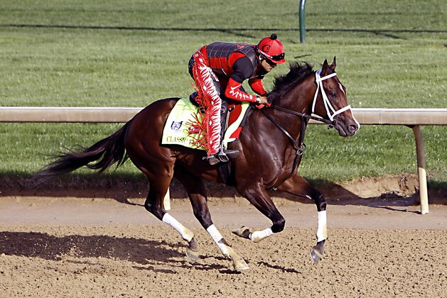 Kentucky Derby hopeful Classic Empire, ridden by exercise rider Martin Rivera, gallops at Churchill Downs in Louisville, Ky., Monday, May 1, 2017. The 143rd running of the Kentucky Derby is Saturday, May 6.(AP Photo/Garry Jones)
