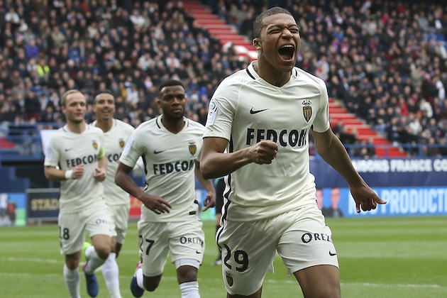 Monaco's Kylian Mbappe celebrates after scoring his first goal during their French League One soccer match against Caen, in Caen, north western France, Sunday, March 19, 2017. Mbappe scored two goals as Monaco won 3-0. (AP Photo/David Vincent)