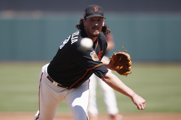 San Francisco Giants starting pitcher Jeff Samardzija warms up prior to a spring training baseball game against the Milwaukee Brewers Sunday, March 19, 2017, in Scottsdale, Ariz. (AP Photo/Ross D. Franklin)