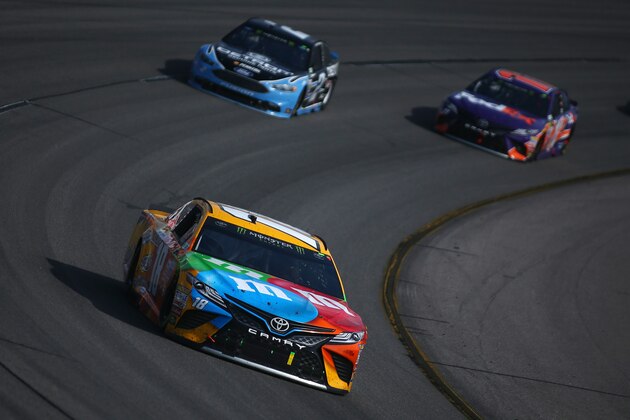 RICHMOND, VA - APRIL 30:  Kyle Busch, driver of the #18 M&M's Toyota, leads Brad Keselowski, driver of the #2 Detroit Genuine Parts Ford, and Denny Hamlin, driver of the #11 FedEx Ground Toyota, during the Monster Energy NASCAR Cup Series Toyota Owners 400 at Richmond International Raceway on April 30, 2017 in Richmond, Virginia.  (Photo by Sarah Crabill/Getty Images)