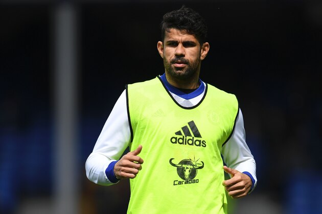 Chelsea's Brazilian-born Spanish striker Diego Costa warms up before the English Premier League football match between Everton and Chelsea at Goodison Park in Liverpool, north west England on April 30, 2017. / AFP PHOTO / Paul ELLIS / RESTRICTED TO EDITORIAL USE. No use with unauthorized audio, video, data, fixture lists, club/league logos or 'live' services. Online in-match use limited to 75 images, no video emulation. No use in betting, games or single club/league/player publications.  /         (Photo credit should read PAUL ELLIS/AFP/Getty Images)