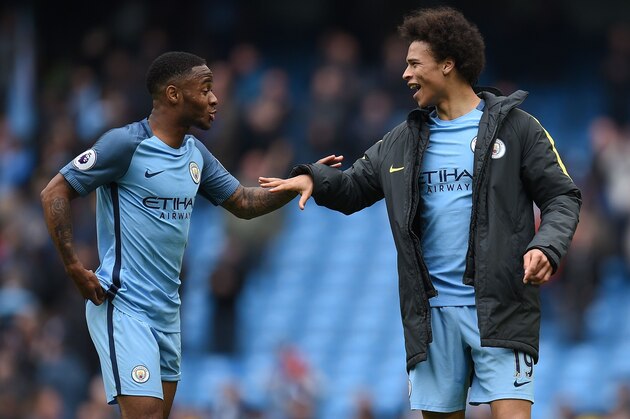 Manchester City's English midfielder Raheem Sterling (L) and Manchester City's German midfielder Leroy Sane react following the English Premier League football match between Manchester City and Crystal Palace at the Etihad Stadium in Manchester, north west England, on May 6, 2017.
Manchester City won the match 5-0. / AFP PHOTO / Oli SCARFF / RESTRICTED TO EDITORIAL USE. No use with unauthorized audio, video, data, fixture lists, club/league logos or 'live' services. Online in-match use limited to 75 images, no video emulation. No use in betting, games or single club/league/player publications.  /         (Photo credit should read OLI SCARFF/AFP/Getty Images)