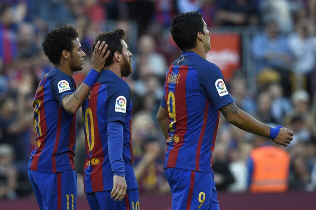 Barcelona's Argentinian forward Lionel Messi (C) is congratulated by Barcelona's Brazilian forward Neymar (L) beside Barcelona's Uruguayan forward Luis Suarez (R) after scoring a goal during the Spanish league football match FC Barcelona vs Villarreal CF at the Camp Nou stadium in Barcelona on May 6, 2017. / AFP PHOTO / LLUIS GENE        (Photo credit should read LLUIS GENE/AFP/Getty Images)