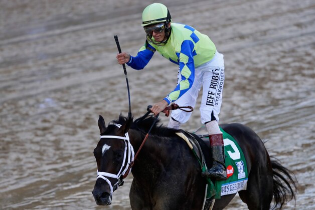 LOUISVILLE, KY - MAY 06:  Jockey John Velazquez celebrates as he guides Always Dreaming #5 across the finish line to win the 143rd running of the Kentucky Derby at Churchill Downs on May 6, 2017 in Louisville, Kentucky.  (Photo by Jamie Squire/Getty Images)