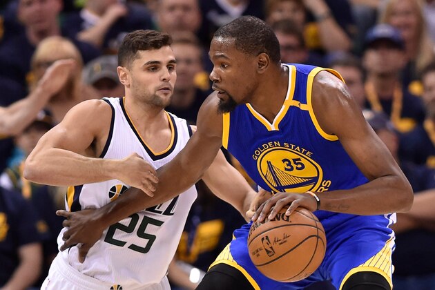 SALT LAKE CITY, UT - MAY 6: Raul Neto #25 of the Utah Jazz defends against Kevin Durant #35 of the Golden State Warriors in the first half in Game Three of the Western Conference Semifinals during the 2017 NBA Playoffs at Vivint Smart Home Arena on May 6, 2017 in Salt Lake City, Utah. NOTE TO USER: User expressly acknowledges and agrees that, by downloading and or using this photograph, User is consenting to the terms and conditions of the Getty Images License Agreement. (Photo by Gene Sweeney Jr/Getty Images)