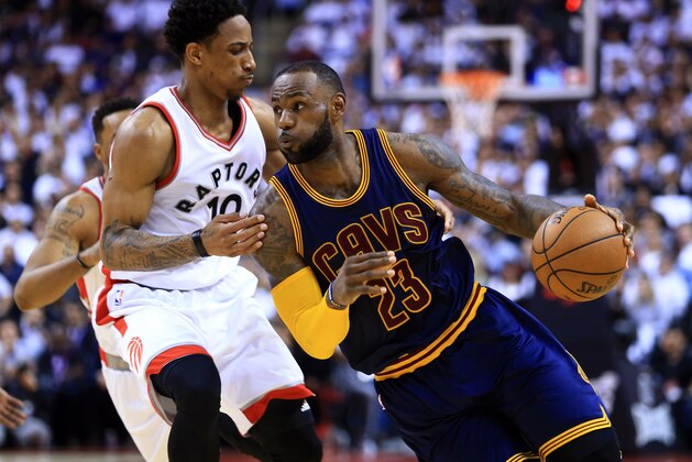 TORONTO, ON - MAY 05:  Lebron James #23 of the Cleveland Cavaliers dribbles the ball as DeMar DeRozan #10 of the Toronto Raptors defends in the second half of Game Three of the Eastern Conference Semifinals during the 2017 NBA Playoffs at Air Canada Centre on May 5, 2017 in Toronto, Canada.  NOTE TO USER: User expressly acknowledges and agrees that, by downloading and or using this photograph, User is consenting to the terms and conditions of the Getty Images License Agreement.  (Photo by Vaughn Ridley/Getty Images)