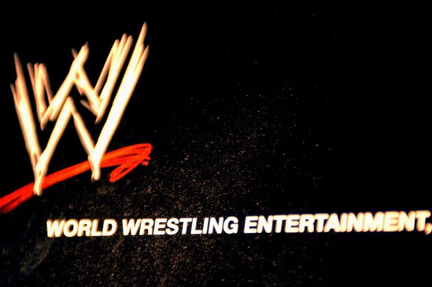 NEW YORK - MARCH 18:  The World Wrestling Entertainment logo hangs on a wall at a media conference announcing the all-star lineup of WWE WrestleMania XIX at ESPN Zone in Times Square March 18, 2003 in New York City.  (Photo by Mark Mainz/Getty Images)