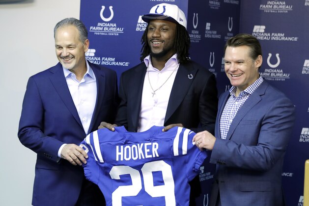 Indianapolis Colts first round draft pick Malik Hooker, center, holds a jersey with head coach Chuck Pagano, left, and general manager Chris Ballard during an NFL football news conference Friday, April 28, 2017, in Indianapolis. (AP Photo/Darron Cummings)