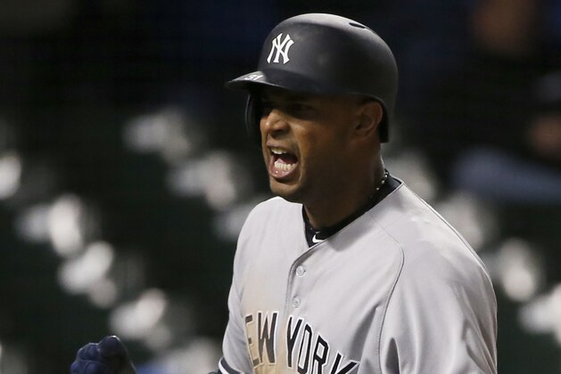 New York Yankees' Aaron Hicks reacts after scoring on a fielder's choice by Chicago Cubs shortstop Addison Russell during the 18th inning of an interleague baseball game Monday, May 8, 2017 in Chicago. (AP Photo/Nam Y. Huh)