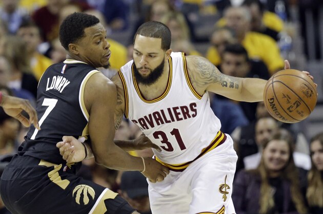 Cleveland Cavaliers' Deron Williams (31) drives past Toronto Raptors' Kyle Lowry (7) in the first half in Game 2 of a second-round NBA basketball playoff series, Wednesday, May 3, 2017, in Cleveland. (AP Photo/Tony Dejak)