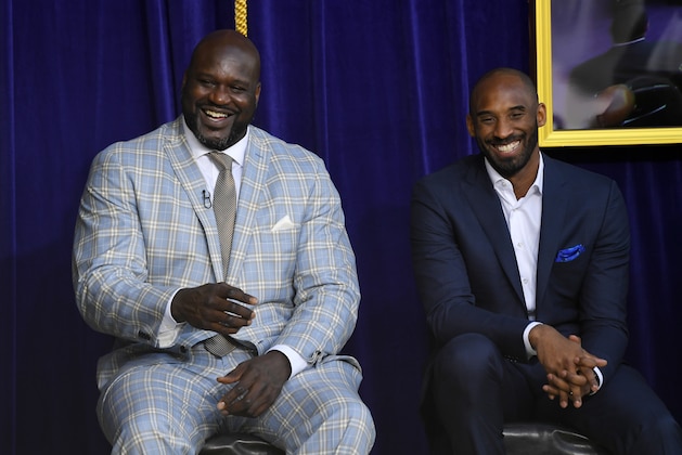 Shaquille O'Neal, left, and Kobe Bryant chat at the unveiling of his statue in front of Staples Center, Friday, March 24, 2017, in Los Angeles. (AP Photo/Mark J. Terrill)