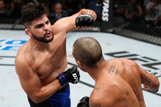 FORTALEZA, BRAZIL - MARCH 11:  (L-R) Kelvin Gastelum punches Vitor Belfort of Brazil in their middleweight bout during the UFC Fight Night event at CFO - Centro de FormaÂco Olimpica on March 11, 2017 in Fortaleza, Brazil. (Photo by Buda Mendes/Zuffa LLC/Zuffa LLC via Getty Images)