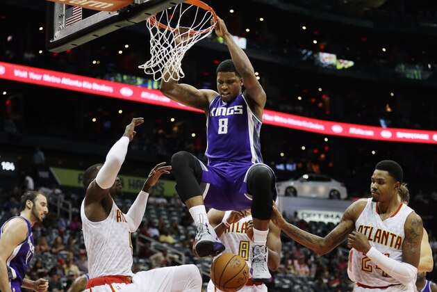 Sacramento Kings' Rudy Gay, right, dunks the ball against Atlanta Hawks' Paul Millsap, left, in the third quarter of an NBA basketball game in Atlanta, Monday, Oct. 31, 2016. (AP Photo/David Goldman)
