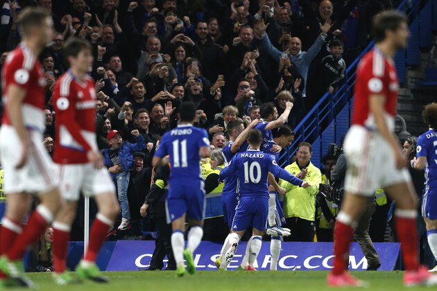 Chelsea's Serbian midfielder Nemanja Matic celebrates with teammates after scoring their third goal during the English Premier League football match between Chelsea and Middlesbrough at Stamford Bridge in London on May 8, 2017. / AFP PHOTO / Ian KINGTON / RESTRICTED TO EDITORIAL USE. No use with unauthorized audio, video, data, fixture lists, club/league logos or 'live' services. Online in-match use limited to 75 images, no video emulation. No use in betting, games or single club/league/player publications.  /         (Photo credit should read IAN KINGTON/AFP/Getty Images)