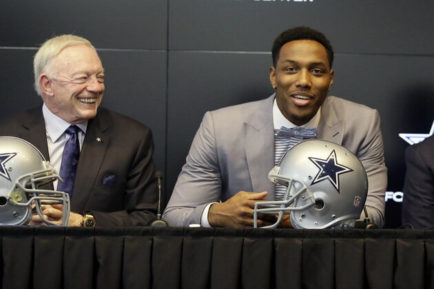 Dallas Cowboys No. 1 draft pick defensive end Taco Charlton, center, speaks to reporters with team owner Jerry Jones, left, and head coach Jason Garrett looking on during a news conference at the team's football headquarters in Frisco, Texas, Friday, April 28, 2017. (AP Photo/LM Otero)