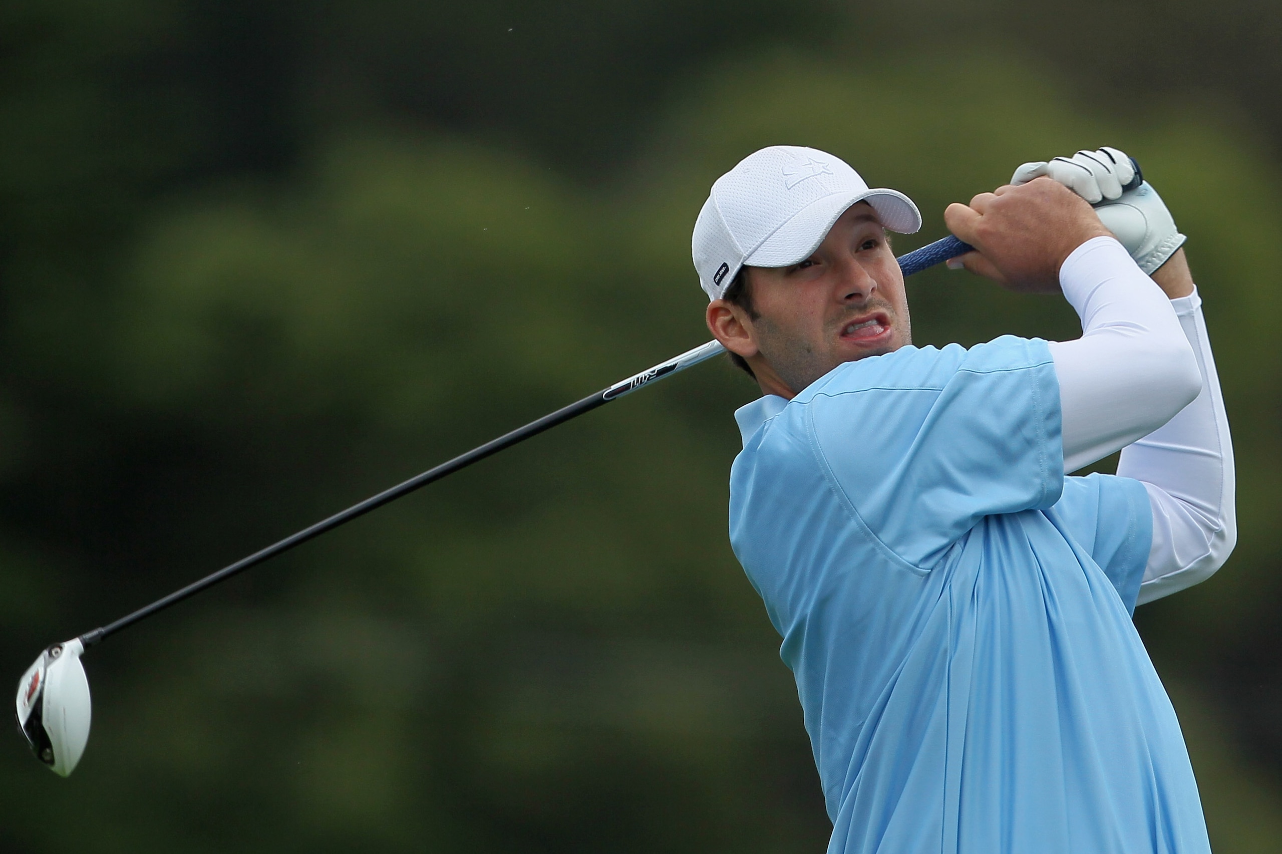 PEBBLE BEACH, CA - FEBRUARY 12:  Tony Romo, NFL football quarterback for the Dallas Cowboys, hits his tee shot on the third hole during the final round of the AT&T Pebble Beach National Pro-Am at Pebble Beach Golf Links on February 12, 2012 in Pebble Beach, California.  (Photo by Jeff Gross/Getty Images)