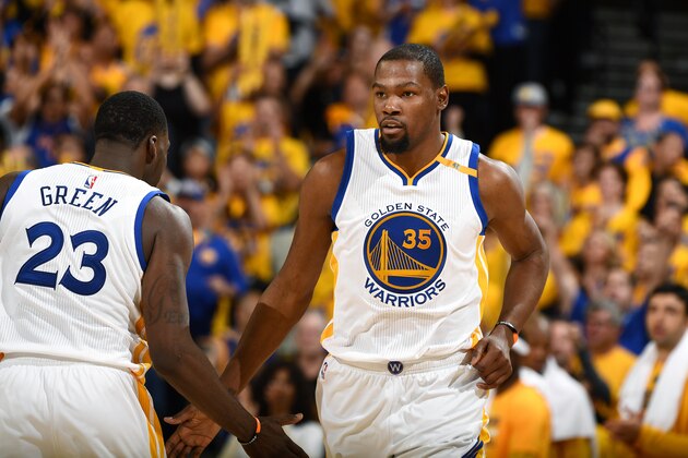 OAKLAND, CA - APRIL 16: Draymond Green #23 and Kevin Durant #35 of the Golden State Warriors high five each other during the game against the Portland Trail Blazers during the Western Conference Quarterfinals of the 2017 NBA Playoffs on April 16, 2017 at Oracle Arena in Oakland, California. NOTE TO USER: User expressly acknowledges and agrees that, by downloading and or using this photograph, user is consenting to the terms and conditions of Getty Images License Agreement. Mandatory Copyright Notice: Copyright 2017 NBAE (Photo by Garrett Ellwood/NBAE via Getty Images)