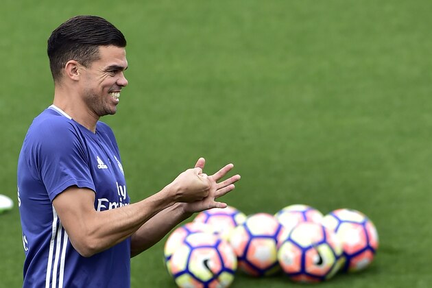 Real Madrid's Portuguese defender Pepe smiles during a training session at Valdebebas training ground in Madrid on May 5, 2017, on the eve of the Spanish League match football match Granada CF vs Real Madrid CF. / AFP PHOTO / GERARD JULIEN        (Photo credit should read GERARD JULIEN/AFP/Getty Images)