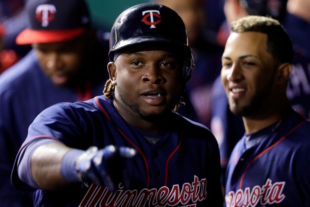 KANSAS CITY, MO - APRIL 28:  Miguel Sano #22 of the Minnesota Twins is congratulated by teammates in the dugout after hitting a two-run home run during the 4th inning of the game against the Kansas City Royals at Kauffman Stadium on April 28, 2017 in Kansas City, Missouri.  (Photo by Jamie Squire/Getty Images)