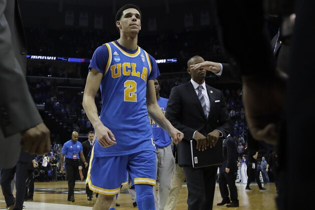 UCLA guard Lonzo Ball (2) leaves the court after UCLA lost to Kentucky in an NCAA college basketball tournament South Regional semifinal game Friday, March 24, 2017, in Memphis, Tenn. (AP Photo/Mark Humphrey)