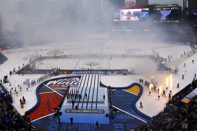 Members of the St. Louis Blues and Chicago Blackhawks are introduced to the crowd prior to the start of the NHL Winter Classic hockey game at Busch Stadium, Monday, Jan. 2, 2017, in St. Louis. (AP Photo/Billy Hurst)