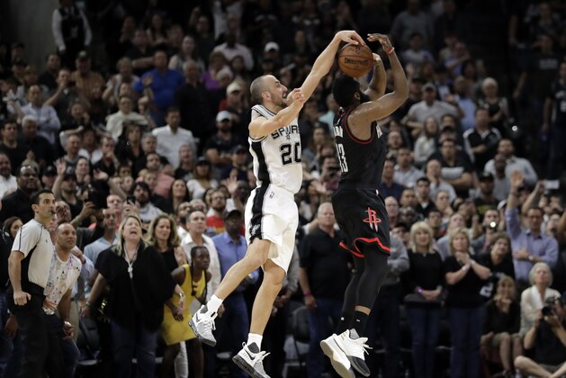 San Antonio Spurs' Manu Ginobili (20) of Argentina blocks Houston Rockets' James Harden three-point shot attempt in the final seconds of overtime of Game 5 in a second-round NBA basketball playoff series, Tuesday, May 9, 2017, in San Antonio. San Antonio won 110-107. (AP Photo/Eric Gay)