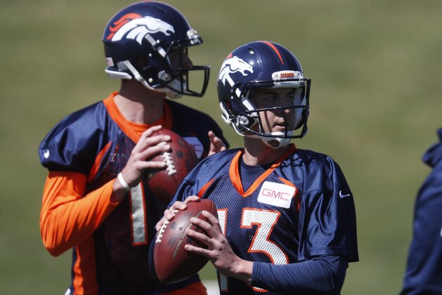 Denver Broncos quarterbacks Trevor Siemian (13) and Paxton Lynch during a voluntary veteran minicamp at the team's headquarters Wednesday, April 26, 2017, in Englewood, Colo. (AP Photo/David Zalubowski)