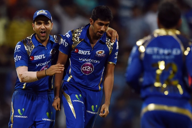 Mumbai Indians captain Rohit Sharma (L) and Jasprit Bumrah (R) celebrate the wicket of Gujarat Lions Dwayne Bravo during the 2016 Indian Premier League(IPL) Twenty20 cricket match between Gujarat Lions and Mumbai Indians at the Wankhede Stadium in Mumbai on April 16, 2016. / AFP / INDRANIL MUKHERJEE / ----IMAGE RESTRICTED TO EDITORIAL USE - STRICTLY NO COMMERCIAL USE----- / GETTYOUT        (Photo credit should read INDRANIL MUKHERJEE/AFP/Getty Images)