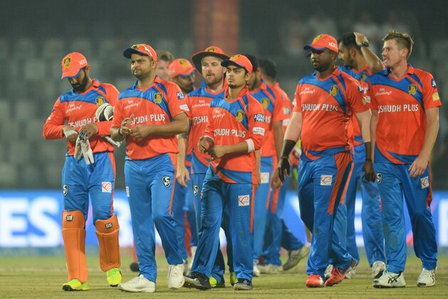 Gujarat Lions team captain Suresh Raina (C) walks off the field along with teammates  after loosing the 2017 Indian Premier League (IPL) Twenty20 cricket match between Delhi Daredevils and Gujarat Lions at the Feroz Shah Kotla Cricket Stadium in New Delhi on May 4,2017.  / AFP PHOTO / SAJJAD HUSSAIN        (Photo credit should read SAJJAD HUSSAIN/AFP/Getty Images)