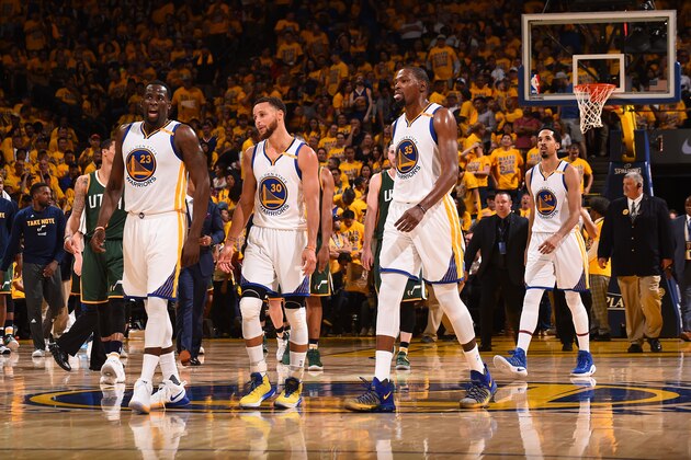 OAKLAND, CA - MAY 2:  Draymond Green #23, Stephen Curry #30 and Kevin Durant #35 of the Golden State Warriors walk off the court after Game One of the Western Conference Semifinals against the Utah Jazz during the 2017 NBA Playoffs on May 2, 2017 at ORACLE Arena in Oakland, California. NOTE TO USER: User expressly acknowledges and agrees that, by downloading and/or using this photograph, user is consenting to the terms and conditions of Getty Images License Agreement. Mandatory Copyright Notice: Copyright 2017 NBAE (Photo by Noah Graham/NBAE via Getty Images)