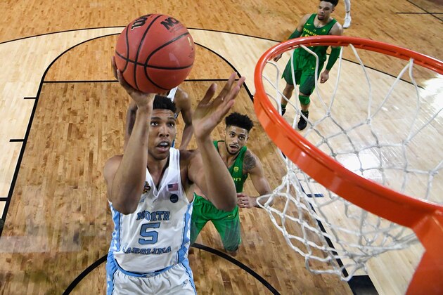 GLENDALE, AZ - APRIL 01: Tony Bradley #5 of the North Carolina Tar Heels shoots against Tyler Dorsey #5 of the Oregon Ducks during the 2017 NCAA Men's Final Four Semifinal at University of Phoenix Stadium on April 1, 2017 in Glendale, Arizona.  (Photo by Chris Steppig - Pool/Getty Images)