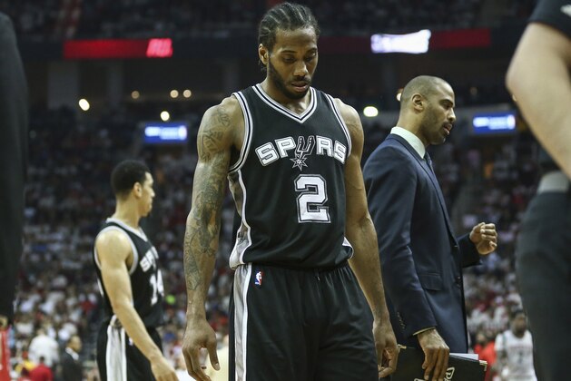 May 7, 2017; Houston, TX, USA; San Antonio Spurs forward Kawhi Leonard (2) walks off the court during a timeout in the third quarter against the Houston Rockets in game four of the second round of the 2017 NBA Playoffs at Toyota Center. Mandatory Credit: Troy Taormina-USA TODAY Sports