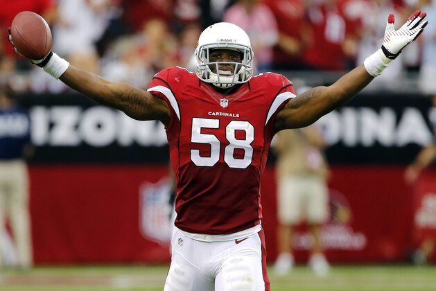 Arizona Cardinals inside linebacker Daryl Washington celebrates his interception against the Atlanta Falcons during the second half of an NFL football game Sunday, Oct. 27, 2013, in Glendale, Ariz. (AP Photo/Matt York)