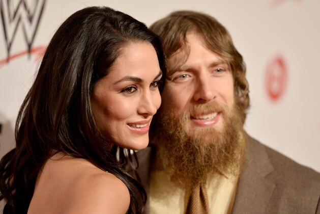 BEVERLY HILLS, CA - AUGUST 15:  WWE Diva Brie Bella (L) and wrestler Daniel Bryan attend WWE & E! Entertainment's 'SuperStars For Hope' at the Beverly Hills Hotel on August 15, 2013 in Beverly Hills, California.  (Photo by Frazer Harrison/Getty Images for WWE)