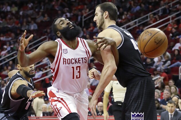 Houston Rockets' James Harden (13) is fouled by Sacramento Kings' Kosta Koufos during the second half of an NBA basketball game, Wednesday, Dec. 14, 2016, in Houston. The Rockets won 132-98. (AP Photo/David J. Phillip)