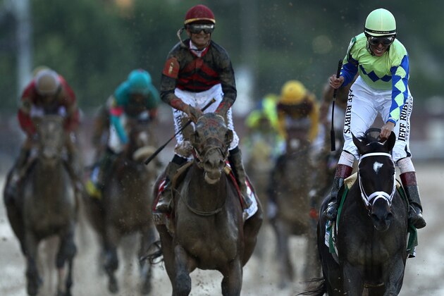 LOUISVILLE, KY - MAY 06: Jockey John Velazquez celebrates atop Always Dreaming #5 as they cross the finish line after winning the 143rd running of the Kentucky Derby at Churchill Downs on May 6, 2017 in Louisville, Kentucky. (Photo by Patrick Smith/Getty Images)