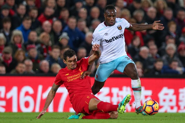 LIVERPOOL, ENGLAND - DECEMBER 11: Michail Antonio of West Ham United and Dejan Lovren of Liverpool during the Premier League match between Liverpool and West Ham United at Anfield on December 11, 2016 in Liverpool, England. (Photo by Robbie Jay Barratt - AMA/Getty Images)