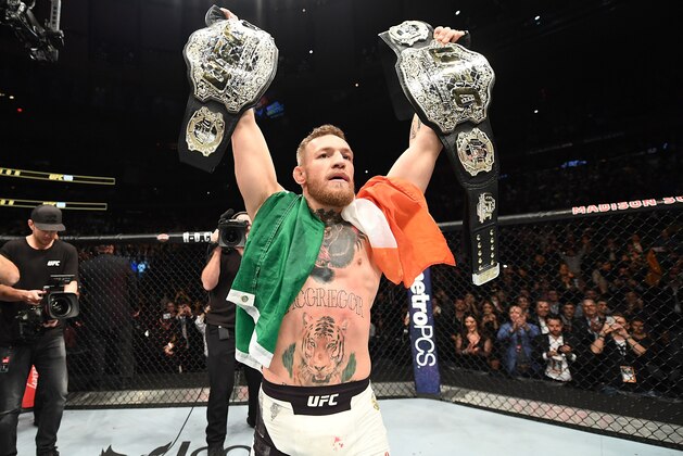 NEW YORK, NY - NOVEMBER 12:  UFC lightweight and featherweight champion Conor McGregor of Ireland celebrates after defeating Eddie Alvarez in their UFC lightweight championship fight during the UFC 205 event at Madison Square Garden on November 12, 2016 in New York City. (Photo by Jeff Bottari/Zuffa LLC/Zuffa LLC via Getty Images)