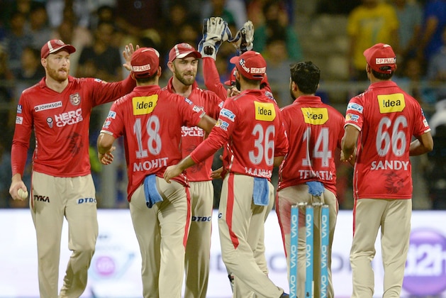 Kings XI Punjab captain Glenn Maxwell (3rd L) celebrates with teammates after the wicket of Mumbai Indians captain Rohit Sharma during the 2017 Indian Premier League (IPL) Twenty20 cricket match between Mumbai Indians and King's XI Punjab at The Wankhede Stadium Cricket Stadium in Mumbai on May 11, 2017. ----IMAGE RESTRICTED TO EDITORIAL USE - STRICTLY NO COMMERCIAL USE----- GETTYOUT  / AFP PHOTO / PUNIT PARANJPE / ----IMAGE RESTRICTED TO EDITORIAL USE - STRICTLY NO COMMERCIAL USE----- GETTYOUT         (Photo credit should read PUNIT PARANJPE/AFP/Getty Images)