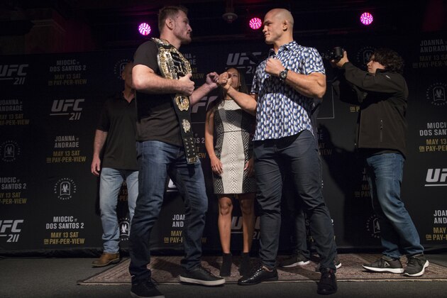 DALLAS, TX - MAY 10:  Stipe Miocic (L) faces off with Junior dos Santos during the UFC 211 Ultimate Media Day at the House of Blues Dallas on May 10, 2017 in Dallas, Texas. (Photo by Cooper Neill/Zuffa LLC/Zuffa LLC via Getty Images)