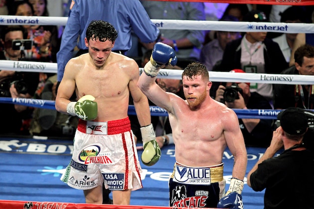 Canelo Alvarez raises his arm in victory after defeating Julio Cesar Chavez, Jr. on May 6, 2017 at the T-Mobile Arena in Las Vegas, Nevada.
Saul 'Canelo' Alvarez cruised to a unanimous decision win over Julio Chavez Jr. in a 12-round beatdown to claim Mexican bragging rights on Cinco de Mayo weekend.  / AFP PHOTO / JOHN GURZINSKI        (Photo credit should read JOHN GURZINSKI/AFP/Getty Images)