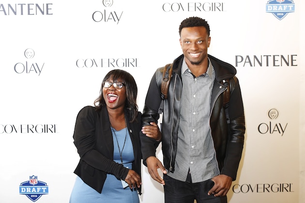 IMAGE DISTRIBUTED FOR P&G - Eli Apple, a cornerback from Ohio State, and his mother Annie Apple laugh as they take photos outside of the P&G VIP Style Lounge, on Wednesday, April 27, 2016 in Chicago. (Alyssa Schukar/AP Images for P&G)