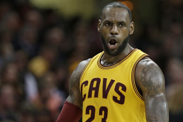Cleveland Cavaliers' LeBron James argues a call with an official in the second half of an NBA basketball game against the Atlanta Hawks, Friday, April 7, 2017, in Cleveland. (AP Photo/Tony Dejak)