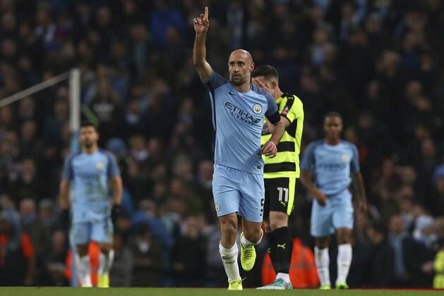 Manchester City's Pablo Zabaleta celebrates after scoring challenge for the ball during the English FA Cup soccer match between Manchester City and Huddersfield Town at the Etihad stadium in Manchester, Wednesday, March 1, 2017.(AP Photo/Dave Thompson)