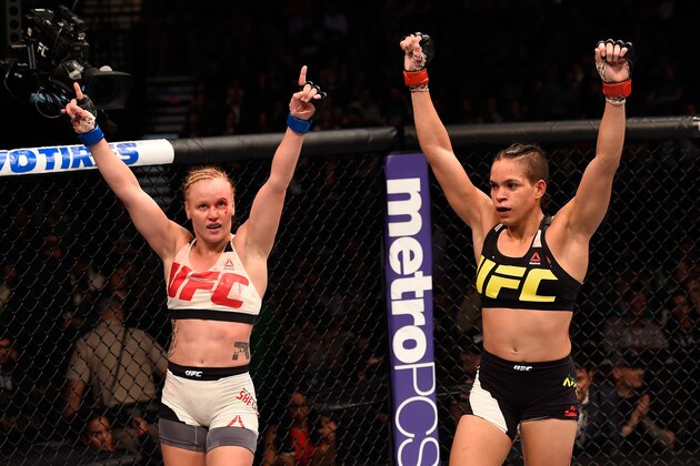 LAS VEGAS, NV - MARCH 05:  (L) Valentina Shevchenko and Amanda Nunes raise their hands after their bantamweight bout during the UFC 196 event inside MGM Grand Garden Arena on March 5, 2016 in Las Vegas, Nevada.  (Photo by Josh Hedges/Zuffa LLC/Zuffa LLC via Getty Images)