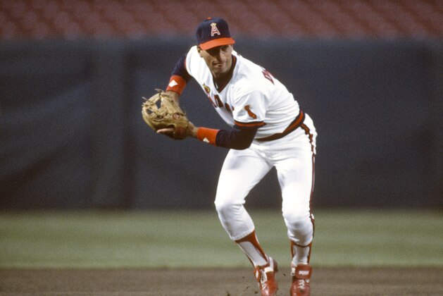 ANAHEIM, CA - CIRCA 1986:  Doug DeCinces #11 of the California Angeles looks to make a throw to first base during an Major League Baseball game circa 1986 at Anaheim Stadium in Anaheim, California.  DeCinces played for the Angeles from 1982-87.  (Photo by Focus on Sport/Getty Images)